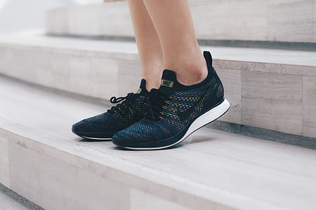 pair of black-and-white Nike sneakers thumbnail