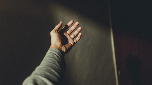 person wearing gray shirt raising right hand thumbnail