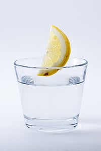 photo of lemon about to drop on glass of water thumbnail