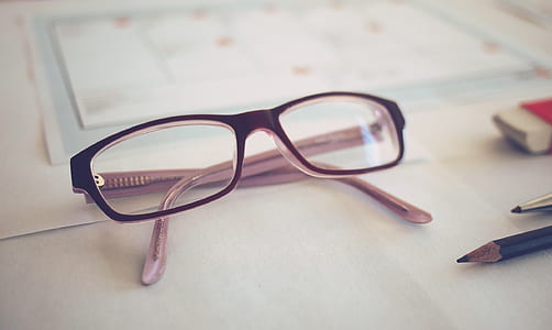 selective focus photography of brown framed eyeglasses thumbnail