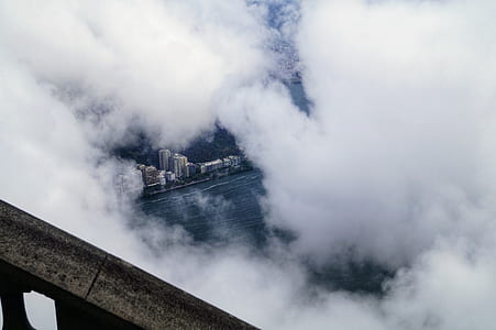 high-rise buildings covered with smoke during daytime thumbnail