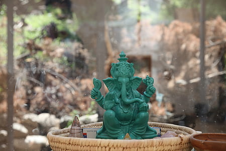 jade Ganesha statue placed on basket thumbnail