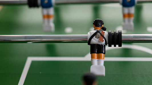 selective focus photography of foosball table thumbnail