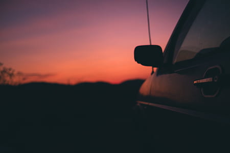 vehicle near silhouette of mountain thumbnail