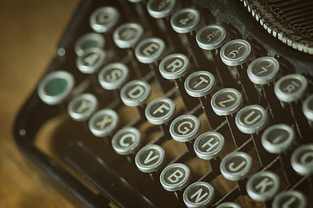 Shallow Photoghrapy of Black and Gray Type Writer Keys thumbnail