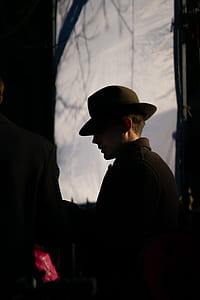 shallow focus photography of a man with hat thumbnail