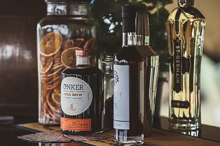 closeup photo of white labeled glass bottle lot on table thumbnail