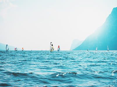Sailboats on Sea Near Mountain thumbnail
