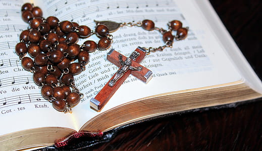 brown rosary bead on opened book thumbnail