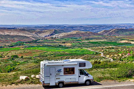 white RV on gray concrete road thumbnail