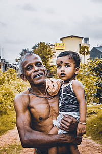 Man Holding a Child thumbnail