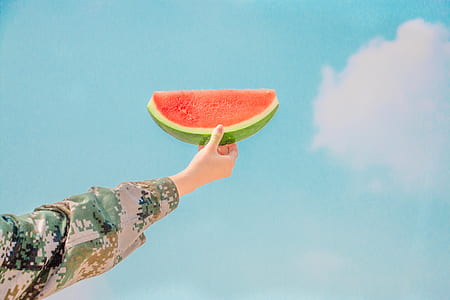 person holding slice watermelon thumbnail