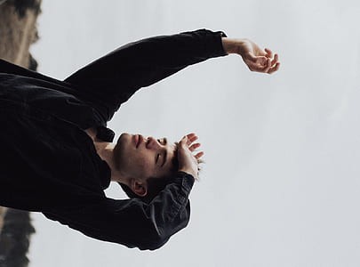 man wearing black dress shirt raising its hand thumbnail