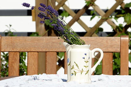 purple lavender flowers in white ceramic vase thumbnail