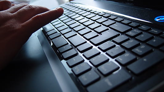 person using black laptop computer thumbnail