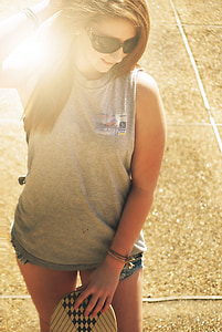 woman holding skateboard thumbnail