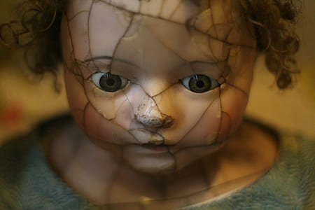 broken brown haired infant doll thumbnail