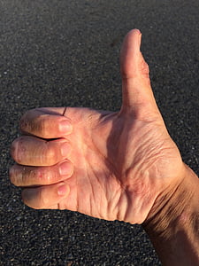 closeup photo of person thumbs up thumbnail