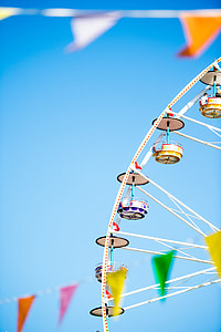 white and red Ferris wheel surrounded buntings thumbnail
