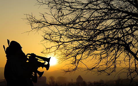 two person playing wind instrument silhouette photo thumbnail