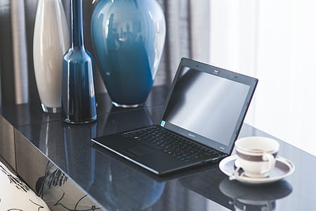 Home office desk with laptop and coffee thumbnail