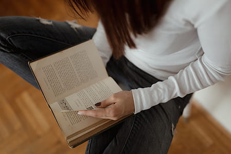 Beautiful young woman reading a book thumbnail