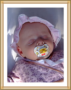 white pacifier on mouth of baby thumbnail