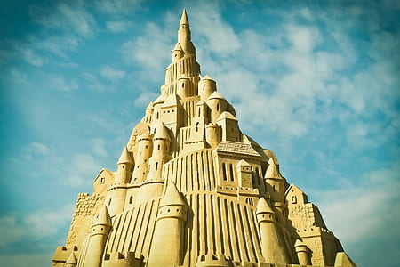 photo of sand castle during daylight thumbnail