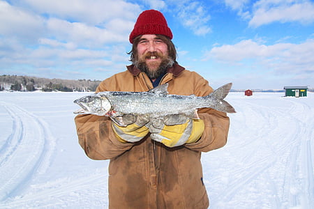 man holding fish thumbnail