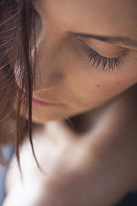 selective focus photo of woman's face thumbnail
