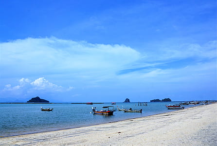 boats on sea near shore thumbnail