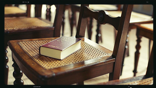 brown book on brown chair thumbnail