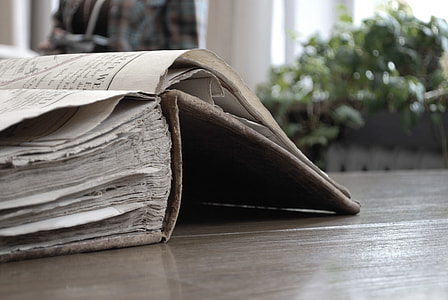 brown hardbound cover book on table thumbnail