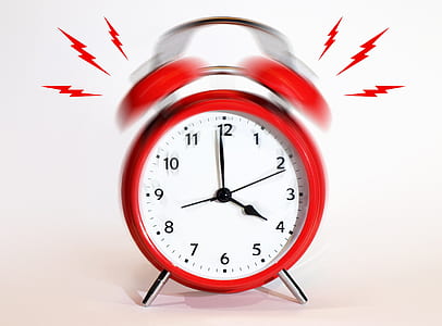round red alarm clock ringed at 4:00 thumbnail