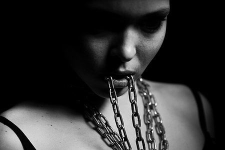grayscale photography of woman eating chain thumbnail