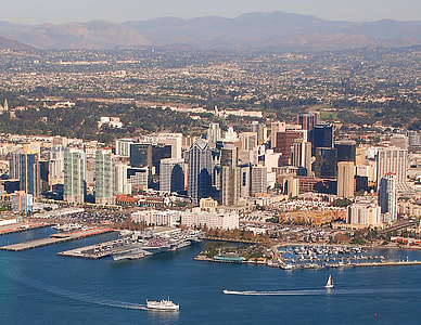 aerial photography of high-rise building beside seashore during daytime thumbnail
