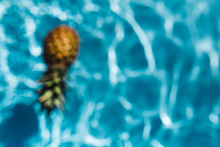 Pineapple in a swimming pool thumbnail