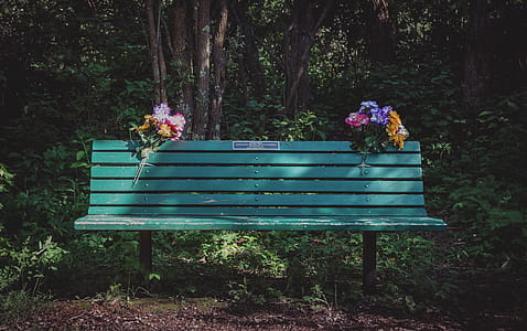 two bouquet of flower on green metal bench thumbnail