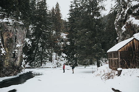 two people standing on snow road thumbnail