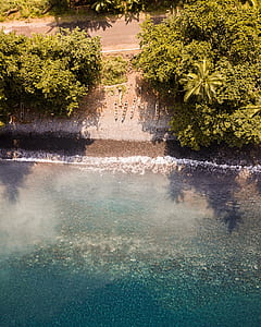 aerial photo of sea shore during daytime thumbnail