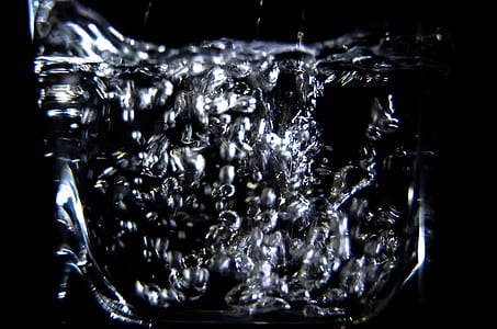 Close-up of Water Splashing Against Black Background thumbnail