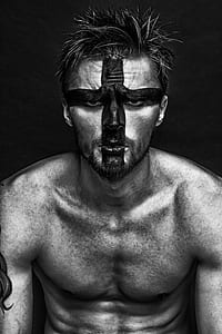 man with painted face grayscale photo thumbnail