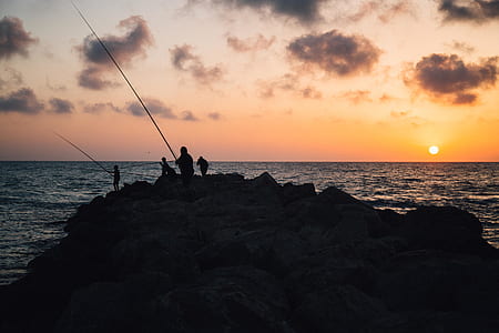 four person fishing during golden hour thumbnail