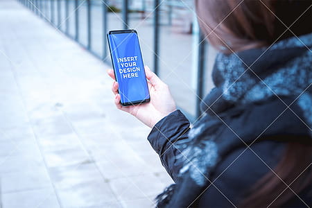 Girl using her modern smartphone. PSD Mockup thumbnail