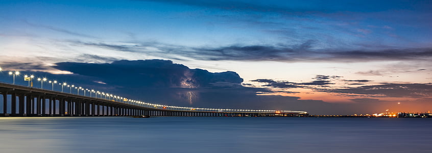 lampposts lighted up on bridge thumbnail