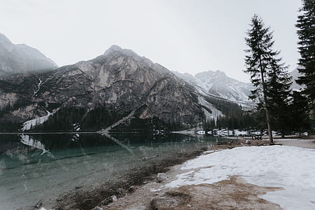 River Near Mountain Under Cloudy Sky thumbnail
