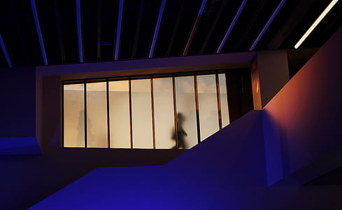 silhouette of person walking on alley thumbnail