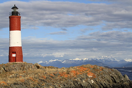 lighthouse near body of water thumbnail