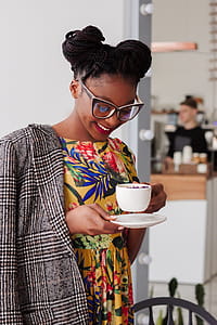 Woman Standing Holding Coffee Mug thumbnail