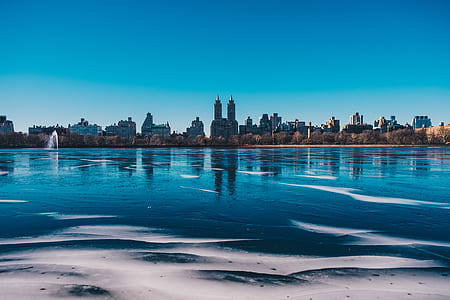 body of water near buildings at daytime thumbnail